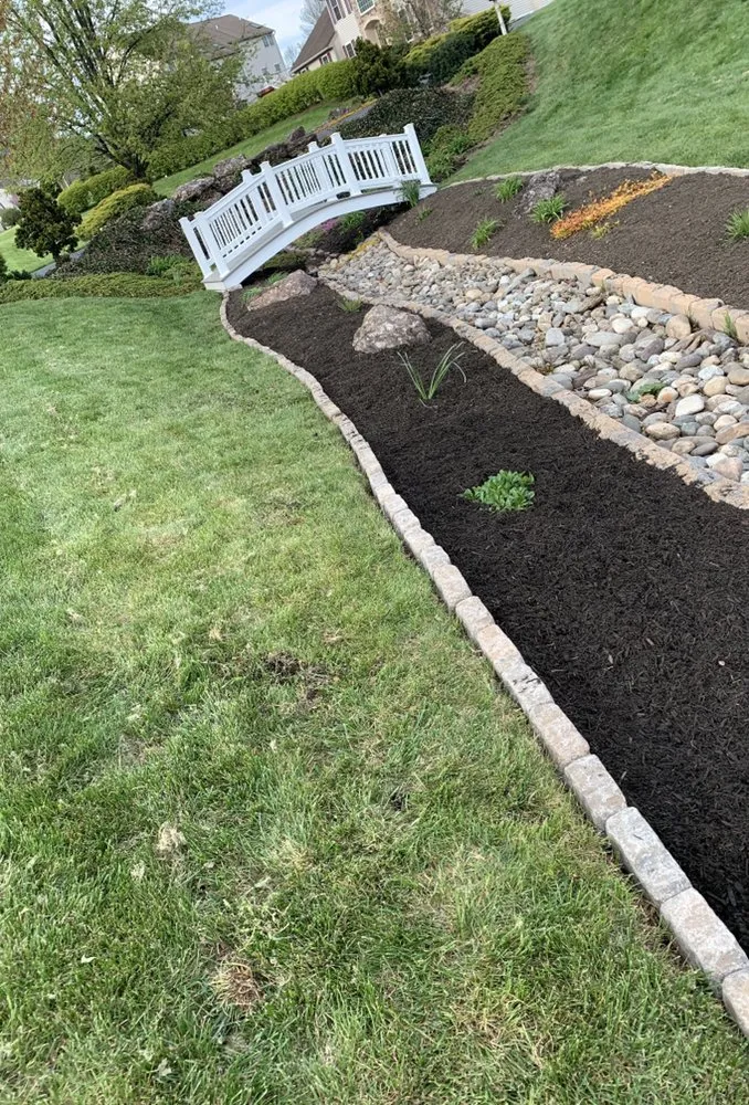 Professional lawn care service for homes in Douglassville, PA by Hustle Lawn And Landscaping