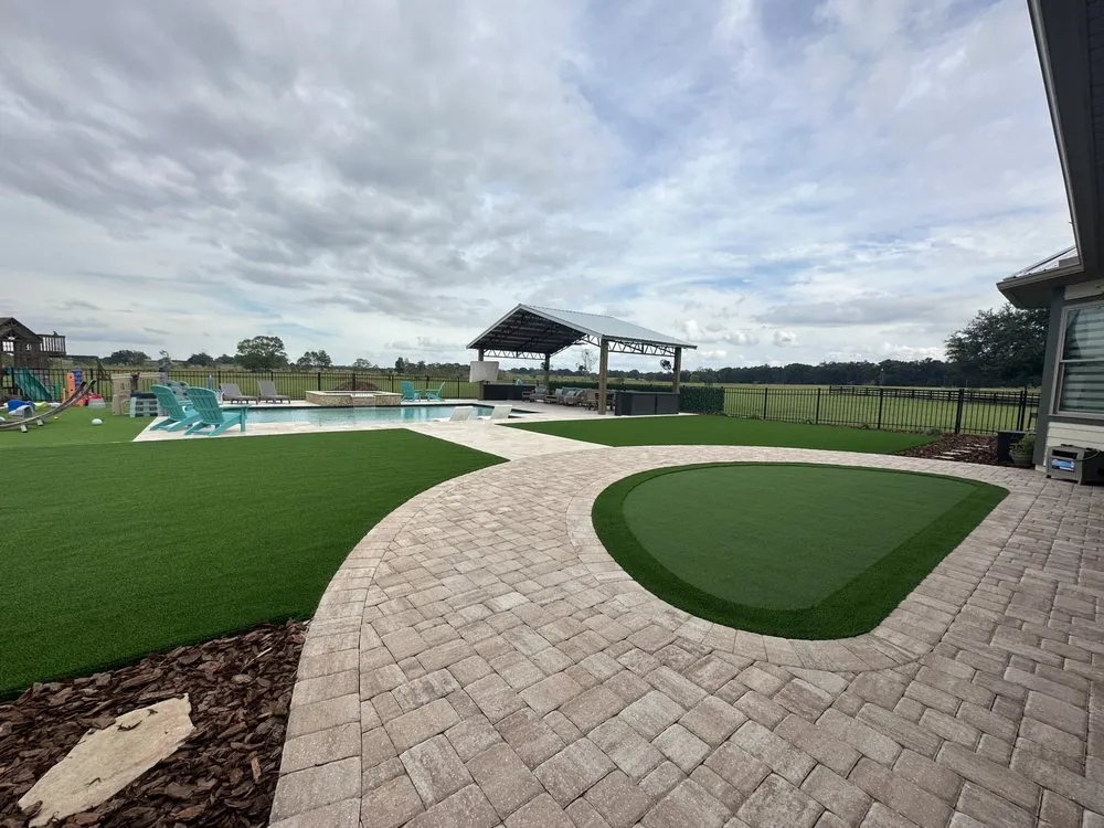 Professional lawn care service for residential properties in Gainesville, FL by Hyer Quality Hardscape & Turf