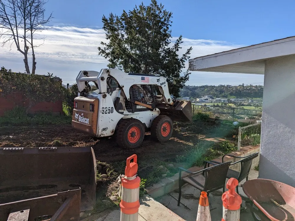 Local landscape design for residential properties in San Diego, CA by IAN Myles Bobcat And Dump Truck