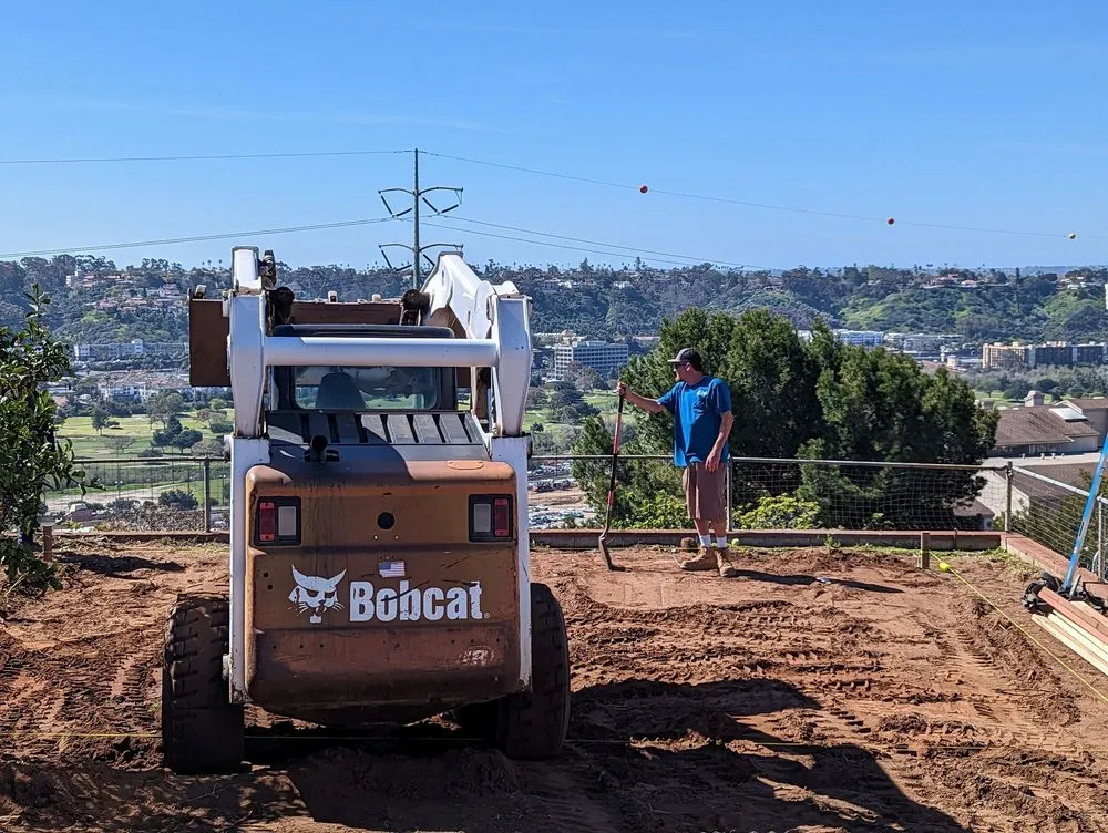 Custom yard cleanup service in San Diego, CA - IAN Myles Bobcat And Dump Truck