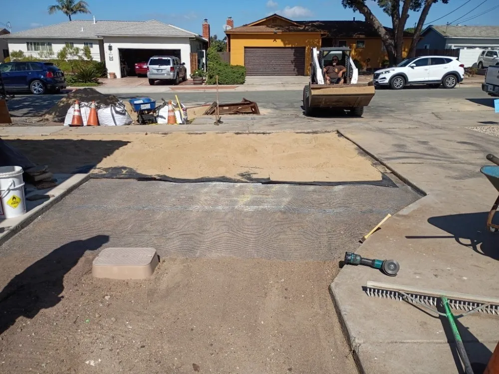 Expert landscape design in San Diego, CA by IAN Myles Bobcat And Dump Truck