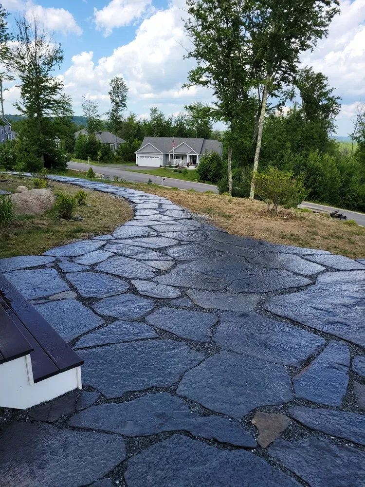 Affordable lawn mowing service for year-round maintenance across Townsend, MA - Iconic Rock Fieldstone Walls