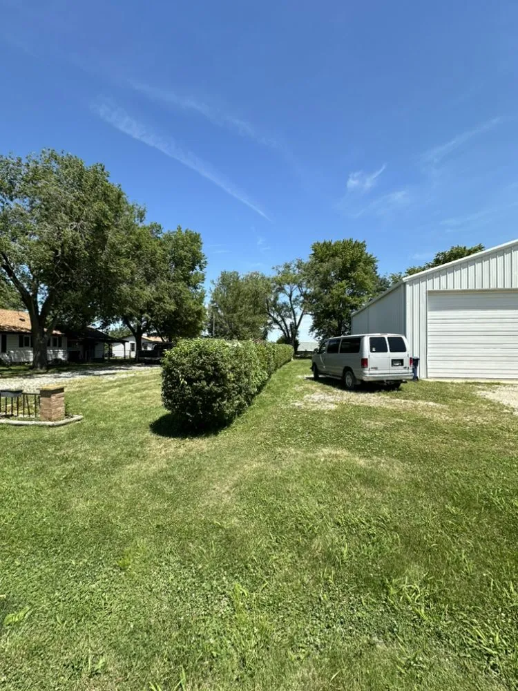 Custom garden landscaping with custom design in Taylorville, IL by Ideal Junk Removal & More