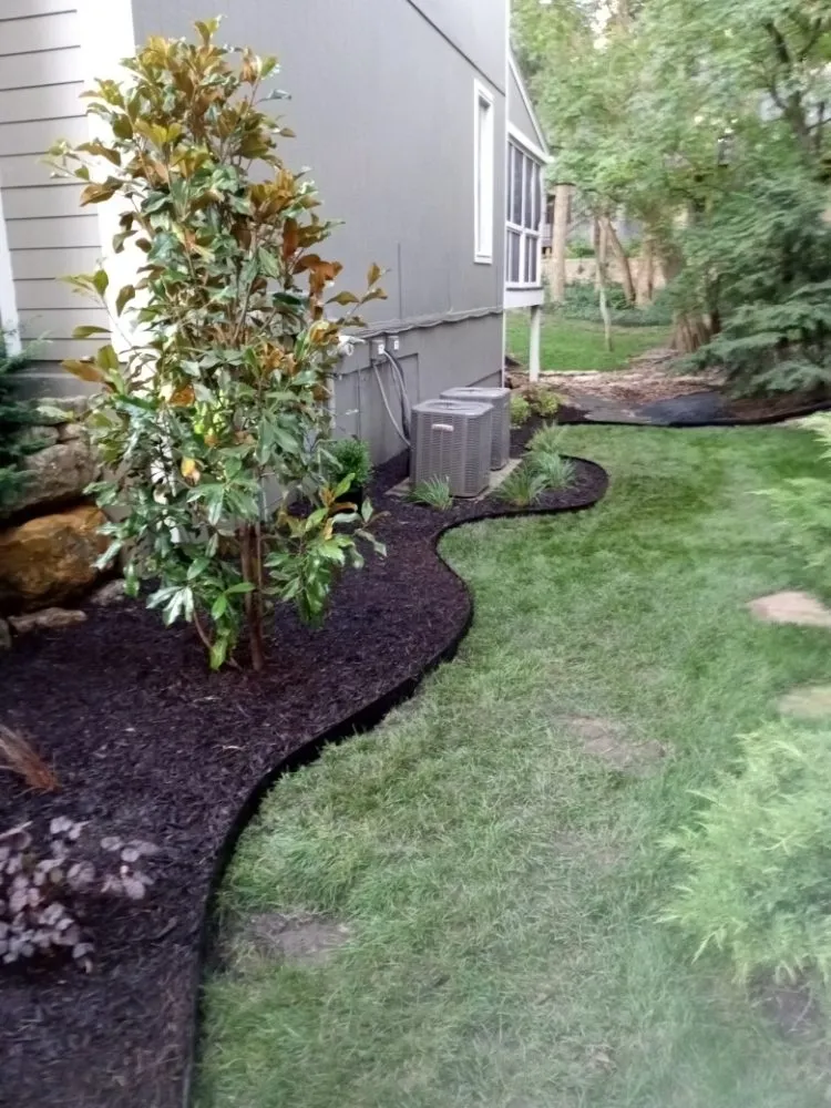Expert lawn care service for year-round maintenance in Overland Park, KS by Idesign Landscapes And Consulting