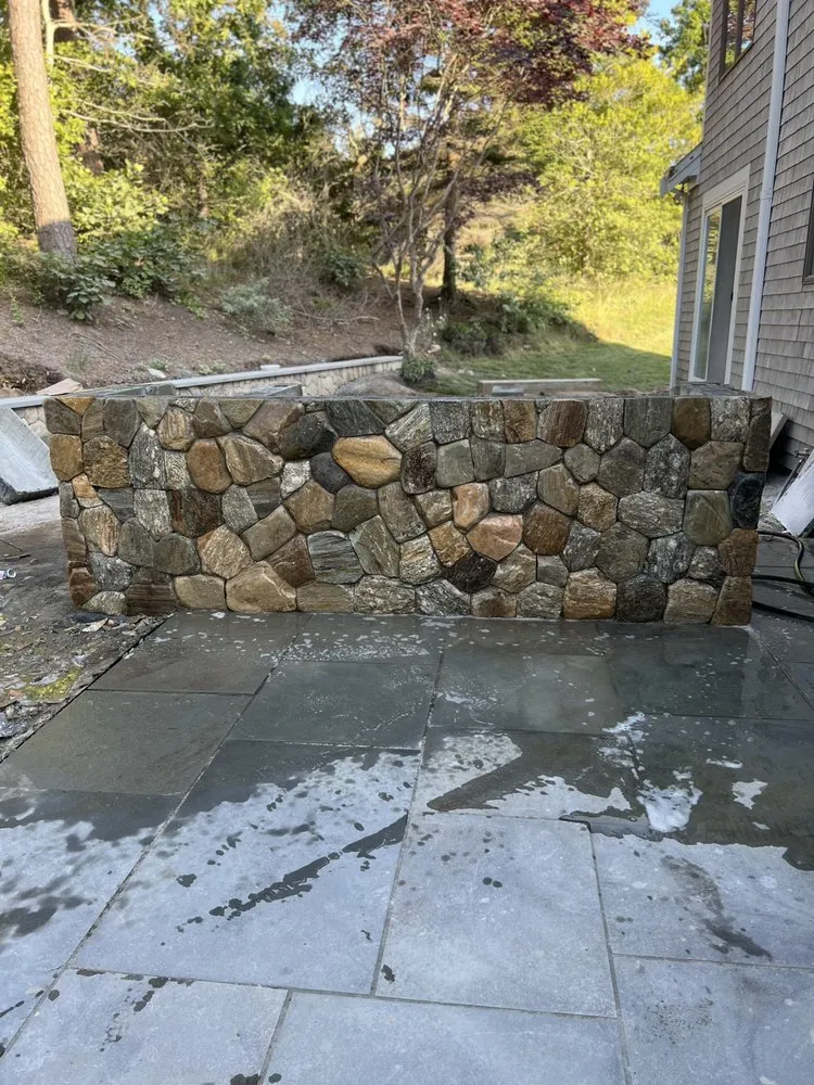 Professional landscaping services for year-round maintenance in Hyannis, MA by Impressive Construction & Landscaping