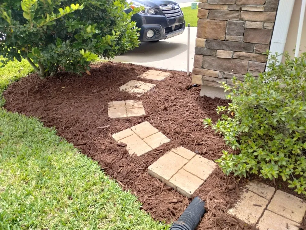 Professional landscape installation for residential properties in St. Augustine, FL by In and Out Landscaping and Cleaning