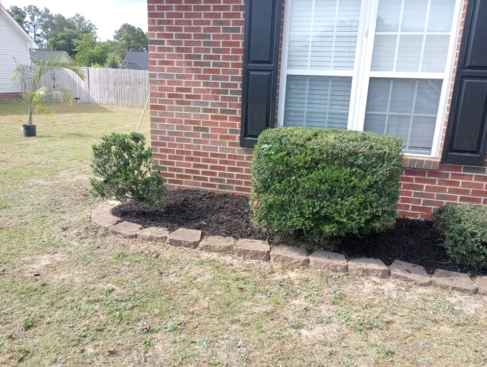 Professional yard maintenance with custom design across Fayetteville, NC - In God We Trust yard care