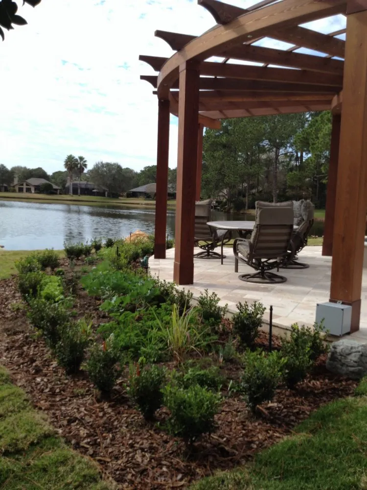 Custom landscape installation in Jacksonville Beach, FL by In The Garden Landscape And Design