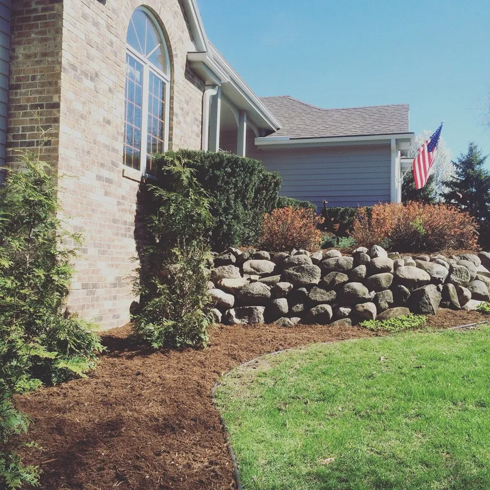 Local lawn mowing service for homes in Oconomowoc, WI by Infused Landscape