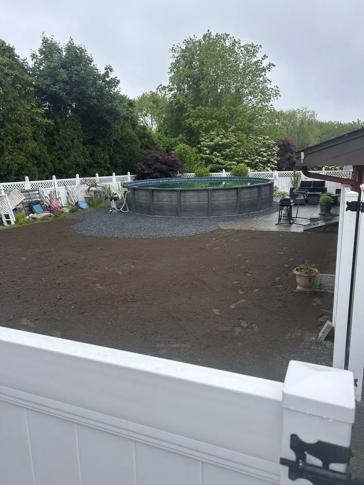 Custom landscape installation in Somerset, MA by Inside Out Construction