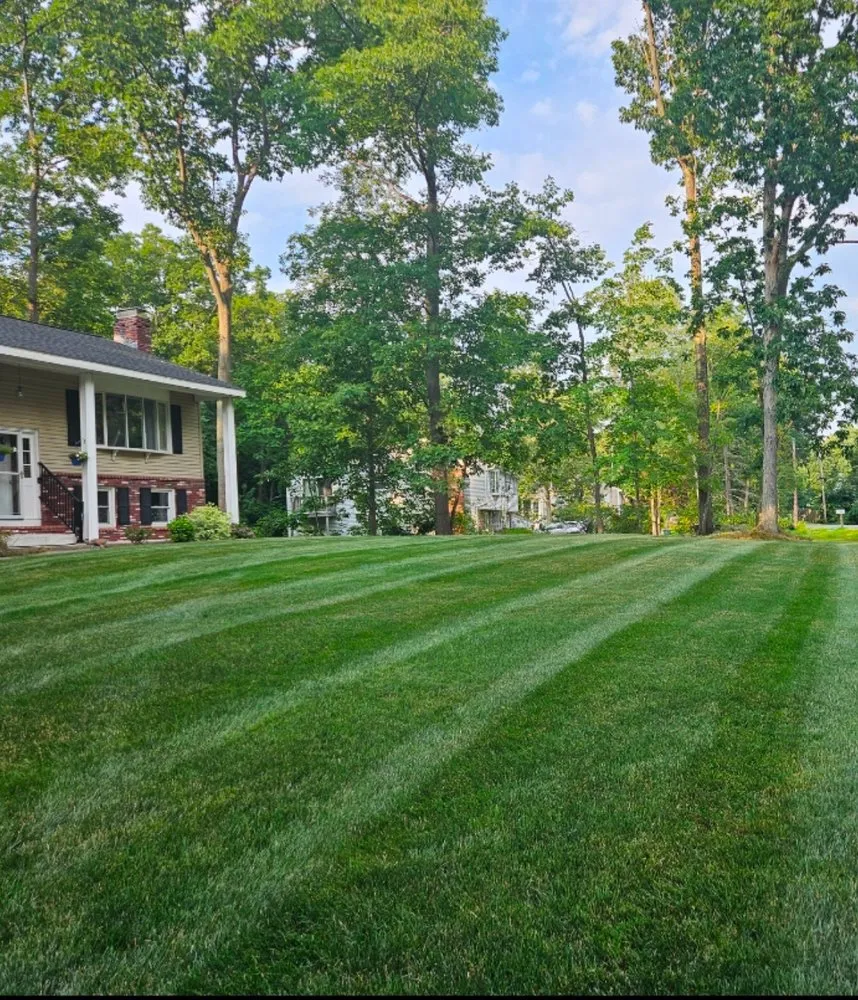 Custom garden landscaping for outdoor upgrades in Atkinson, NH by Integrity Turf Lawncare