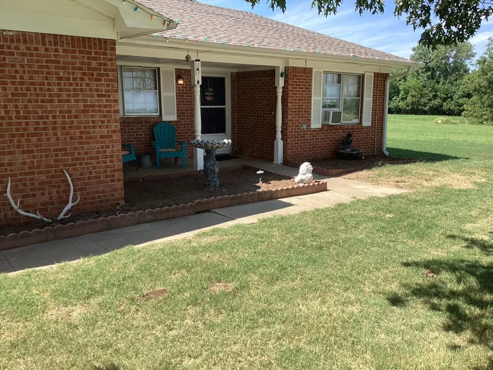 Professional lawn mowing service for outdoor upgrades in Shawnee, OK by Irwin Family Home Solutions