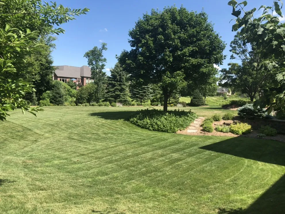 Custom landscape installation in De Pere, WI by Izzy’s Affordable Lawn Care