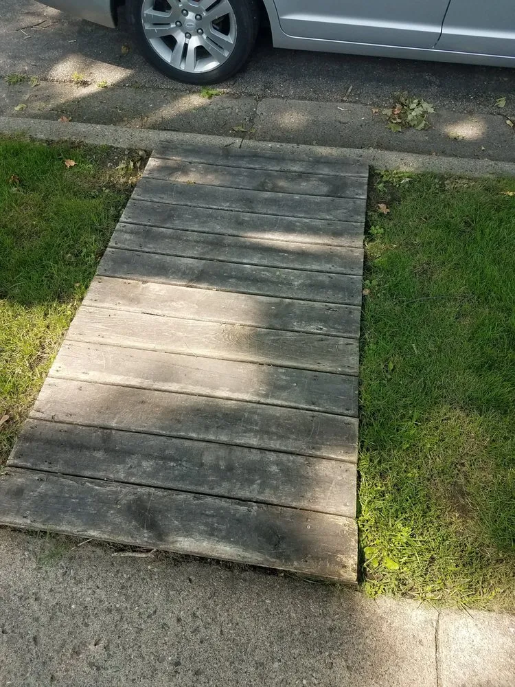 Custom landscape design with custom design in Glencoe, MN by J & M Property Preservation