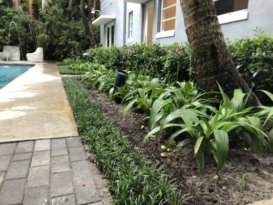 J & T Landscaping Logo