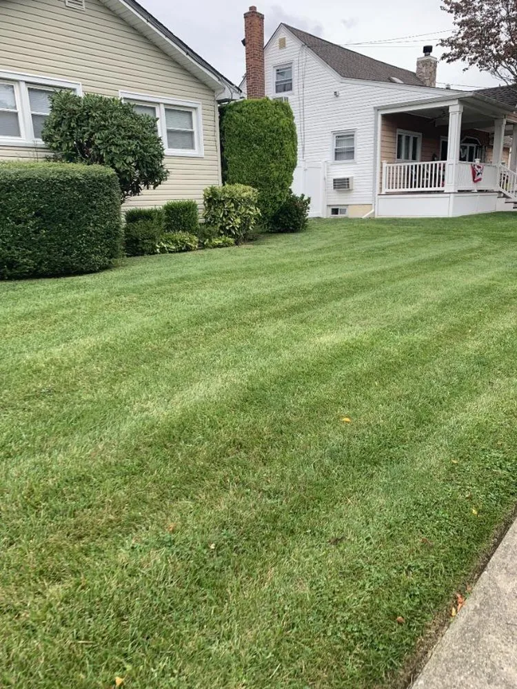 Custom outdoor landscaping for homes in Westbury, NY by J A F Landscaping