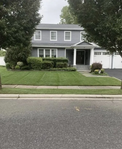 Custom yard cleanup service for residential properties across Westbury, NY - J A F Landscaping