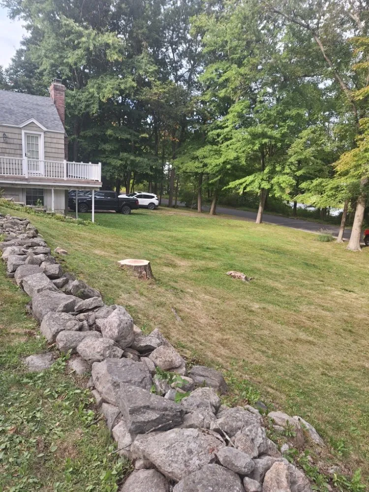 Custom outdoor landscaping for residential properties in Danbury, CT by J J Construcción