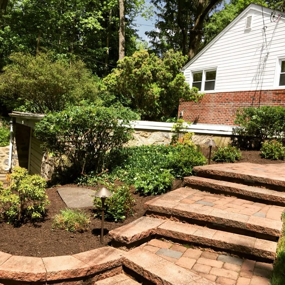 Custom yard cleanup service for year-round maintenance in Folsom, PA by J. Jansen Landscaping