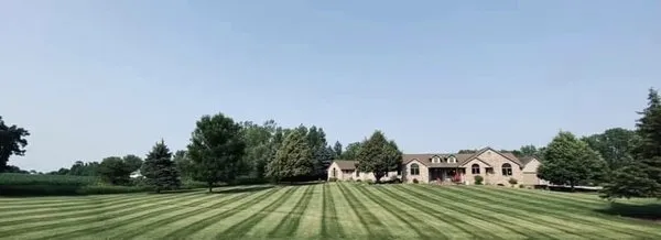 J K Lawn And Maintenance Logo