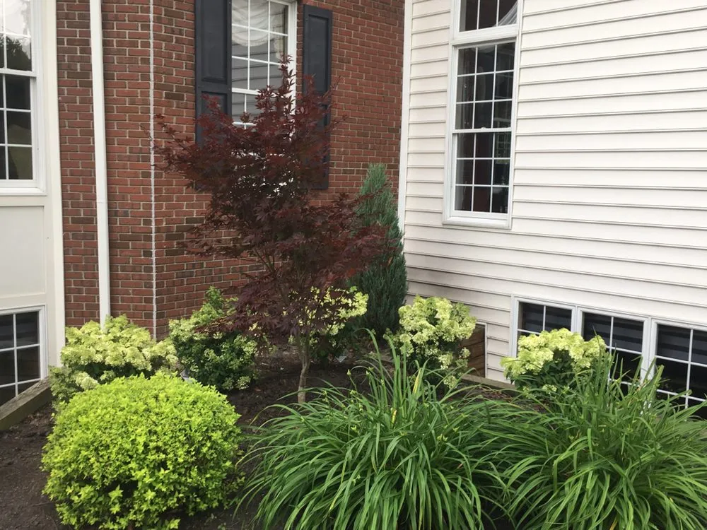 Custom garden landscaping with custom design in North Tonawanda, NY by J W Landscaping and Drainage