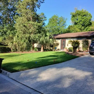 Jason's Ideal Lawn Care Service Logo