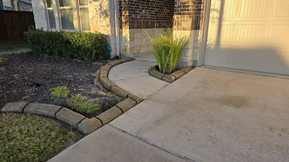 Custom landscape design for homes in Cypress, TX by Jerico Curbing Services