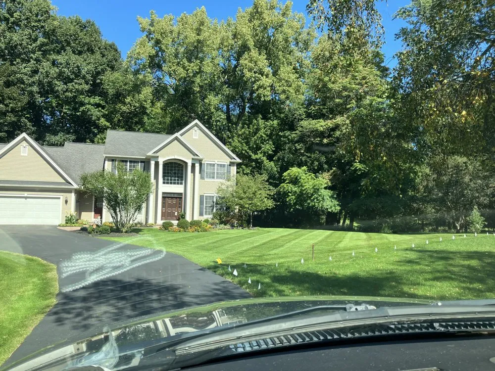 Custom landscape installation with custom design in Shortsville, NY by JF Decker Landscaping