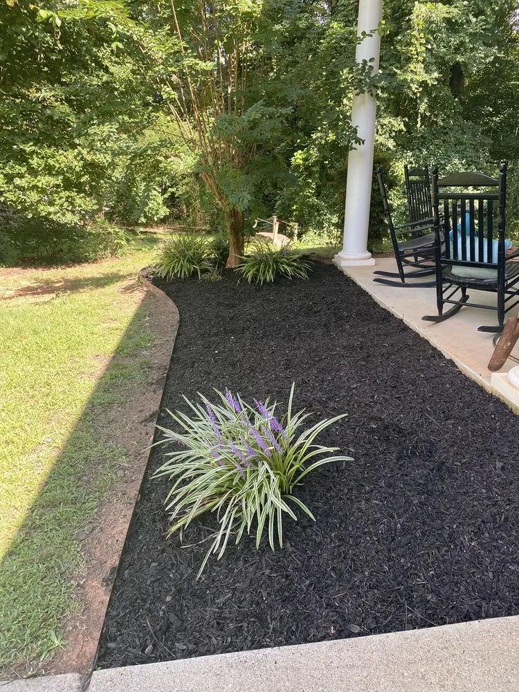 Professional outdoor landscaping with custom design in Snellville, GA by JoeAbel Lawn Care