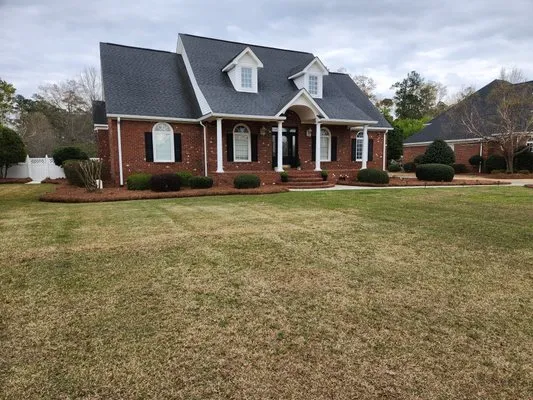 Joel Cox Lawn Care Logo