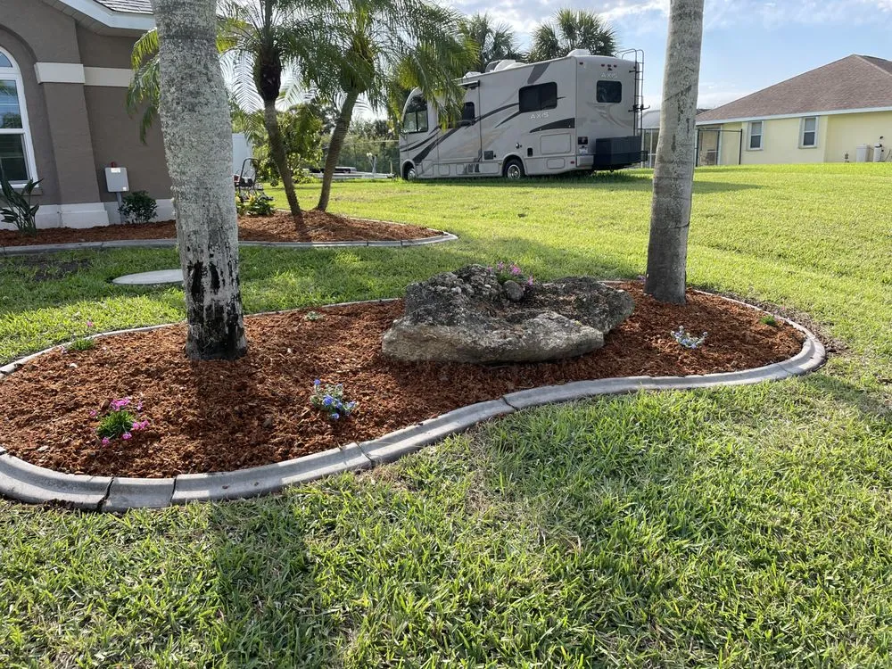 Professional yard cleanup service for residential properties in Port Charlotte, FL by John Comeau & Son Mowing Services