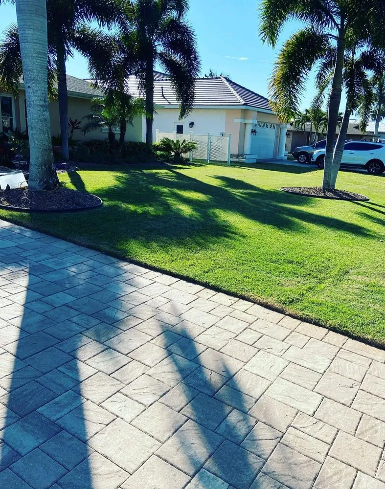 Expert lawn mowing service for homes in Cape Coral, FL by Johnny Green lawn service