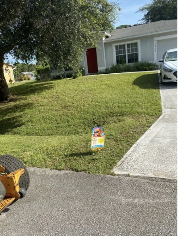 Expert lawn care service for residential properties in Palm Bay, FL by Johnny Tree Trim & Landscaping