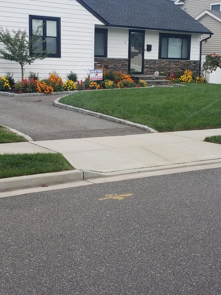 Custom landscape installation in Huntington Station, NY by Johnny's Landscaping