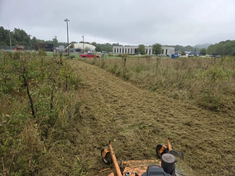 Expert lawn mowing service for residential properties in Huntington, WV by Johnny's Lawn Care and Fencing