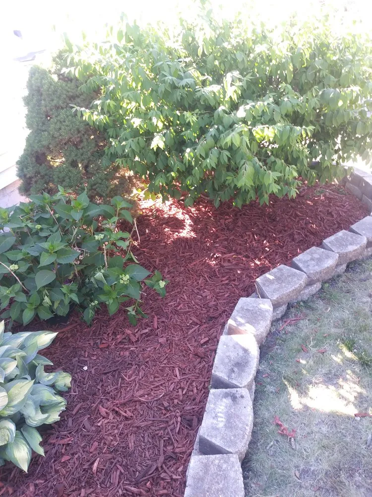 Custom landscape design for year-round maintenance in Hammond, IN by John's Lawn Care Service