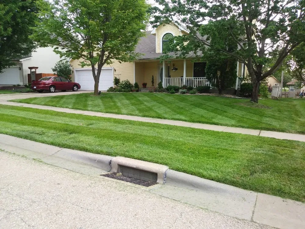 Local landscape installation for year-round maintenance in Topeka, KS by John's Lawn Salon