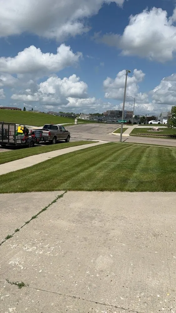 Professional lawn mowing service experts serving Bismarck, ND - Johnson’s Lawn Service