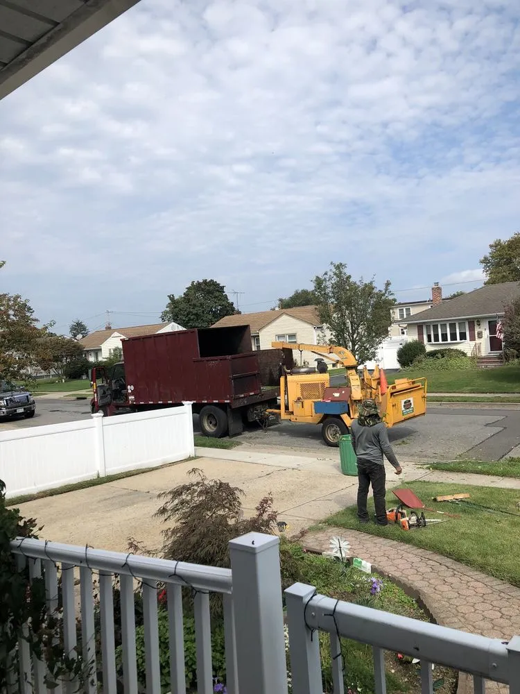 Trusted lawn mowing service for residential properties in Copiague, NY by Jones Tree Service