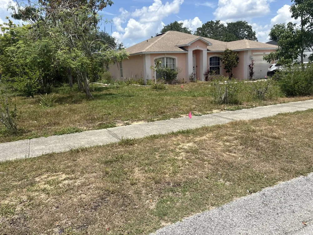 Custom lawn mowing service for residential properties in Davenport, FL by Jovannys Irrigation Services