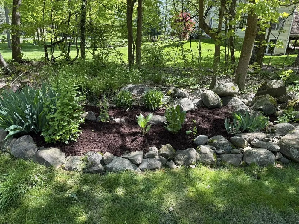 Custom garden landscaping for beautiful yards in Garrettsville, OH by J&S Land and Dump Trailer Services