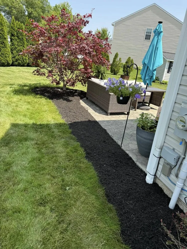 Local lawn care service with custom design in Garrettsville, OH by J&S Land and Dump Trailer Services