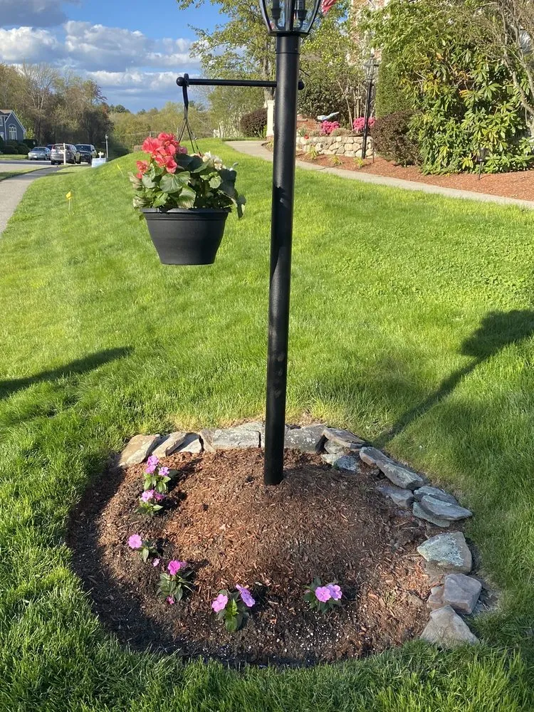 Custom lawn mowing service for year-round maintenance in Reading, MA by JSCS Landscaping