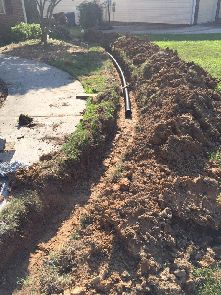 Local lawn mowing service with custom design in Chapel Hill, NC by JT Grading and Drainage Solutions