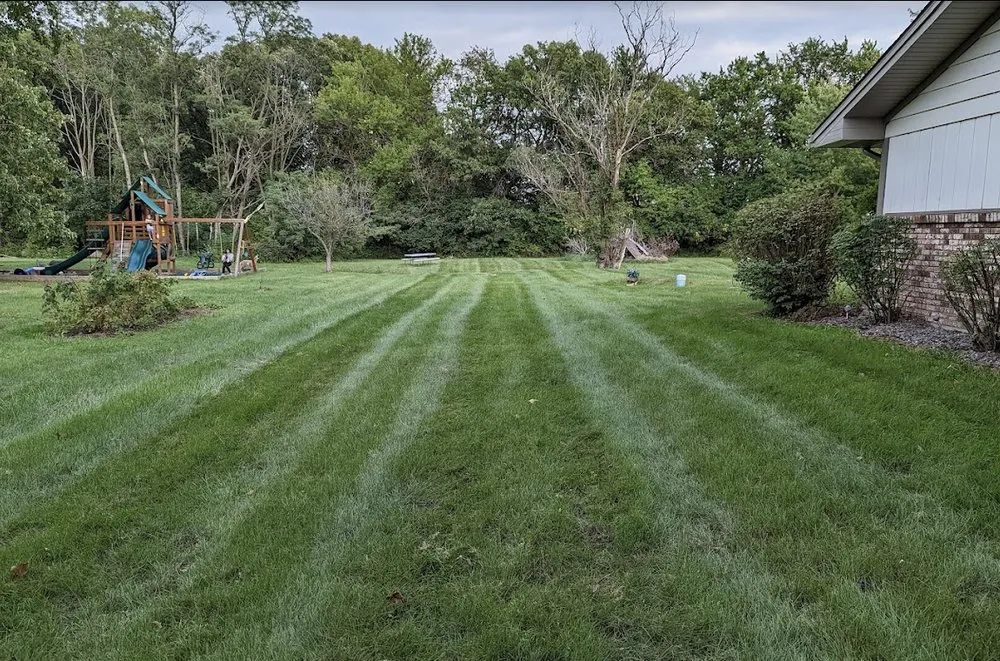 Professional yard cleanup service for homes in Crown Point, IN by JTLK Turf