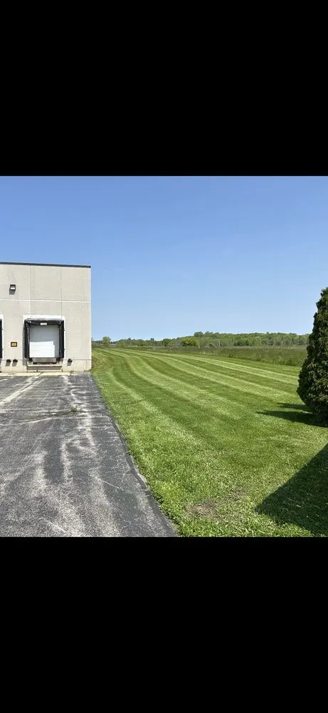 Professional yard cleanup service for homes in Kewaskum, WI by JT's Unique Outdoor Services