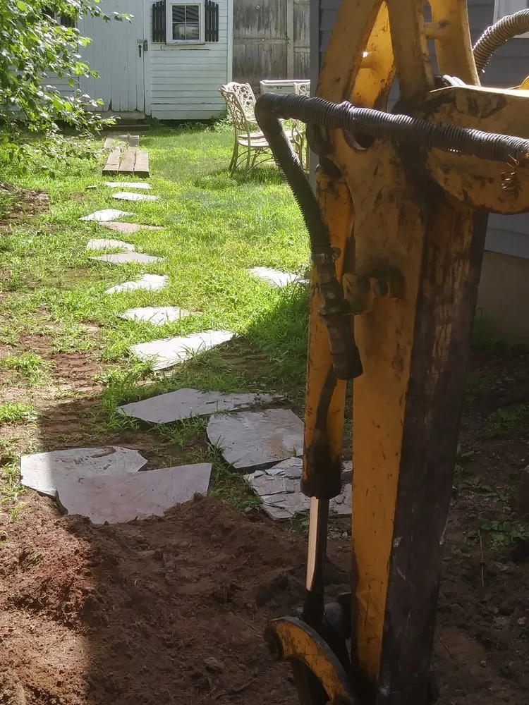 Top-rated lawn care service for homes in Auburndale, MA by Juan Carlos Caruso Landscaping & Snow Plowing