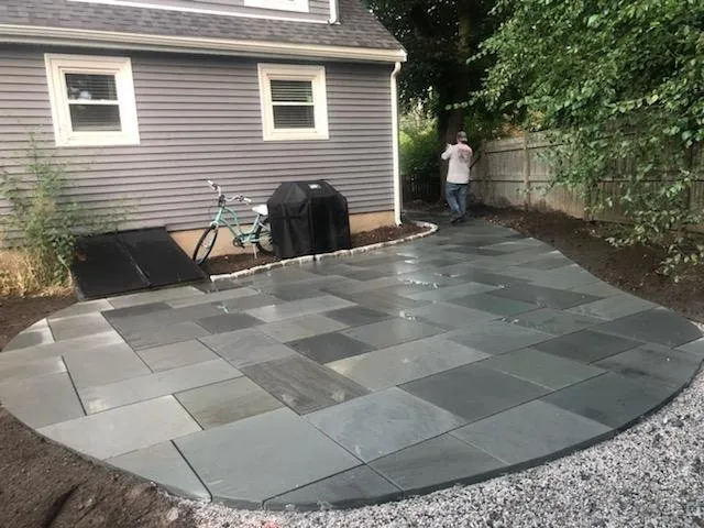 Custom landscape installation for outdoor upgrades in Auburndale, MA by Juan Carlos Caruso Landscaping & Snow Plowing