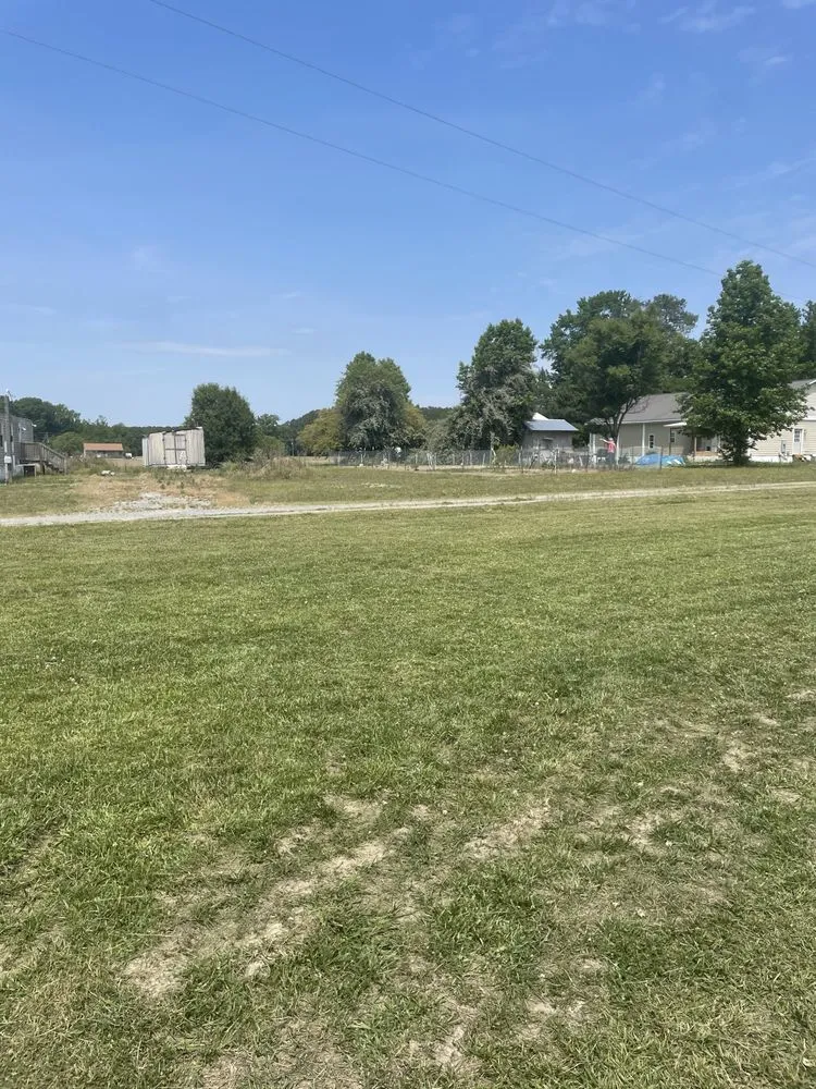 Trusted lawn mowing service for year-round maintenance in Smithfield, NC by JuSt Us Juheme & Stephanie