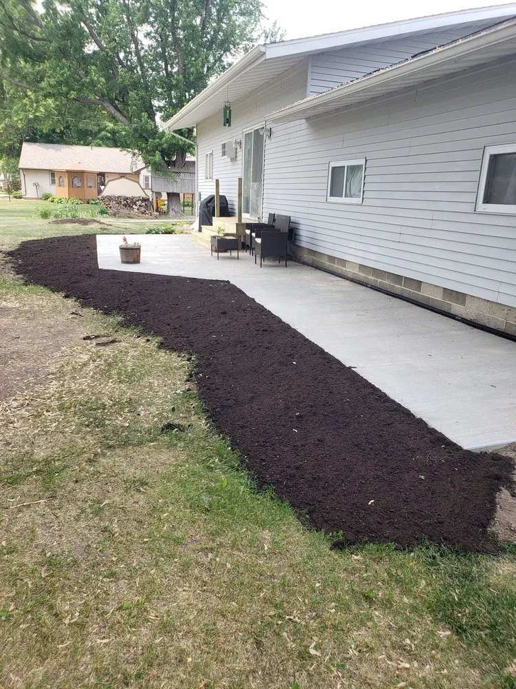 Custom garden landscaping for residential properties in Hutchinson, MN by Justin Wright's Bobcat Service